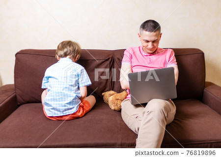 Little Son Offended To His Father Busy With Laptop 76819896
