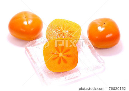 Persimmon cut cross section seedless bright background Persimmon cut cross section seedless bright background 76820162