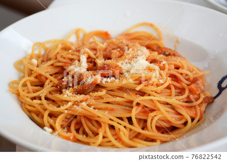 Spaghetti with cheese and tomatoes from an Italian restaurant. Spaghetti with cheese and tomatoes from an Italian restaurant. 76822542
