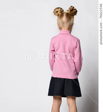 blonde with a stylish hairstyle in a pink blonde with a stylish hairstyle in a pink 76822546