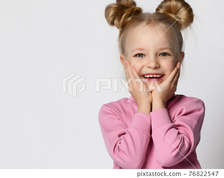 Cheerful active blonde in stylish pink t-shirt Cheerful active blonde in stylish pink t-shirt 76822547