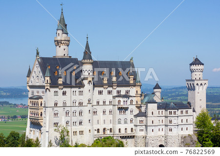 Closeup Neuschwanstein castle on a hill in summer near Schwanstein, Bavaria, Germany, April 2020 Closeup Neuschwanstein castle on a hill in summer near Schwanstein, Bavaria, Germany, April 2020 76822569