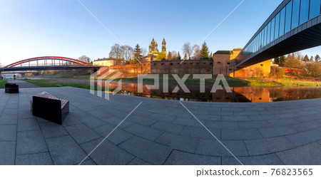 Poznan. Cathedral on Tumskiy Island at sunrise. Poznan. Cathedral on Tumskiy Island at sunrise. 76823565