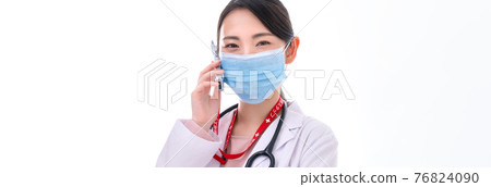 Young female doctor making a phone call Young female doctor making a phone call 76824090