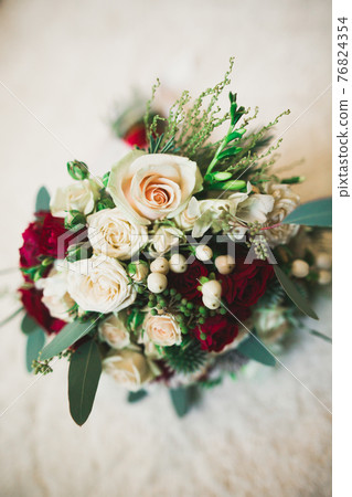 Beautiful wedding bouquet with different flowers, roses 76824354