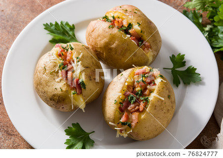 Stuffed potatoes with bacon and cheese Stuffed potatoes with bacon and cheese 76824777