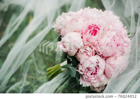 wedding bouquet with peonies at the wedding.Beautiful bouquet of flowers. 76824852