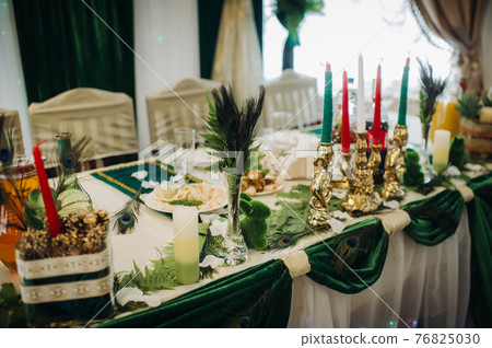 wedding table decoration with flowers on the table in green style, dinner table decor 76825030