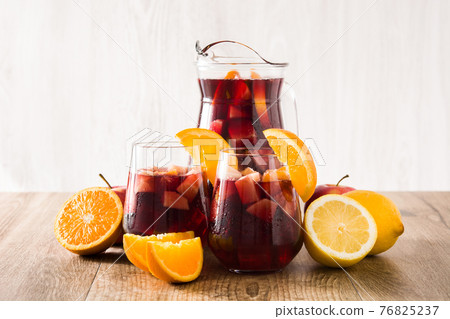Sangria drink in glass on wooden table 76825237