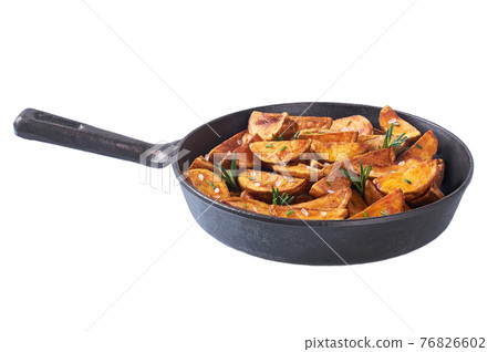 fried potato wedges with salt and rosemary in roasted pan isolated on white background. 76826602