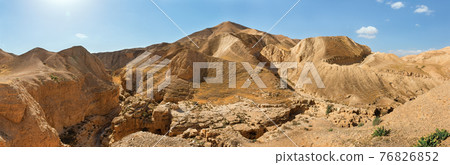 Panorama of the gorge of the dried riverbed of the OG river near the Dead Sea 76826852