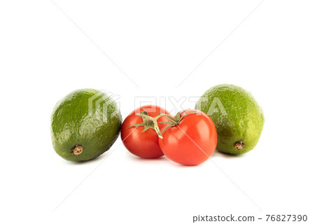 Two avocados and two tomatoes on a white background. 76827390