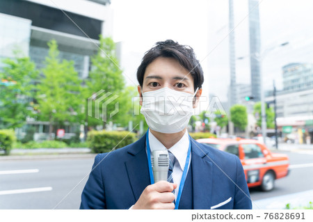 Mask announcer interviewing Tokyo Marunouchi 76828691