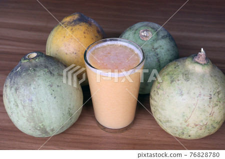 tasty and healthy ripe wood apple with juice tasty and healthy ripe wood apple with juice 76828780