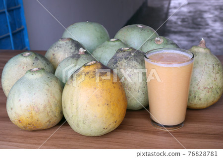tasty and healthy ripe wood apple with juice tasty and healthy ripe wood apple with juice 76828781