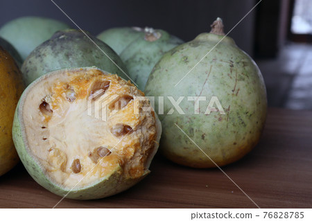 tasty and healthy ripe wood apple with juice 76828785
