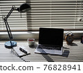 Laptop on the desk 76828941