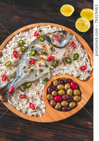 Grilled fish with rice 76829463