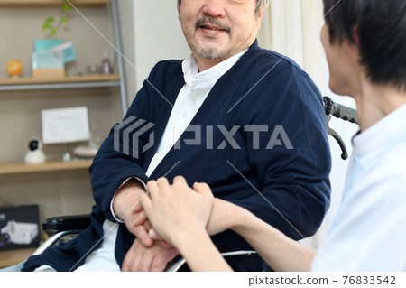 White-haired senior (middle-aged) man having a conversation 76833542