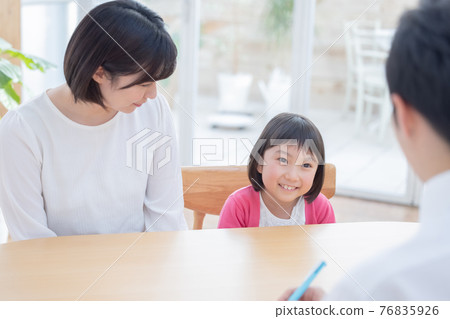 Education Parents and children and teachers undergoing tripartite interviews 76835926