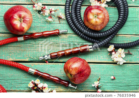 Smoking hookah with apple flavor 76835946