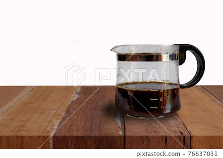Coffee jar glass with cup and coffee maker on background. Coffee jar glass with cup and coffee maker on background. 76837031
