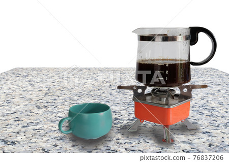 Coffee jar glass on top of camping stove on background. Coffee jar glass on top of camping stove on background. 76837206