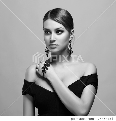 young woman with make-up and necklace young woman with make-up and necklace 76838431