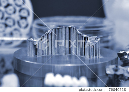 Object with supports created on a laser sintering machine on the work disk Object with supports created on a laser sintering machine on the work disk 76840318