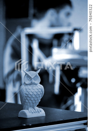 Object printed on a 3d printer close-up in the workshop 76840322