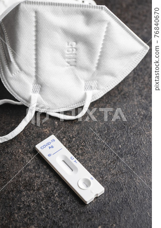Covid-19 rapid antigen test. Rapid antibodies test kit and KN95 respirator face mask. 76840670