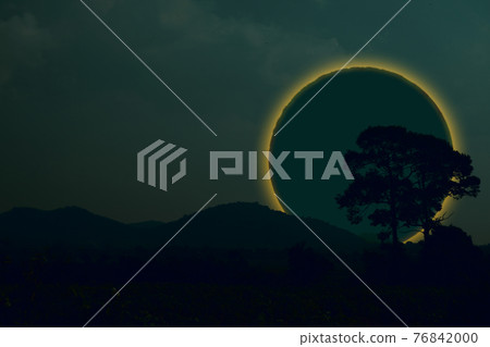 Ring lunar eclipse back silhouette tree and mountain on the night sky Ring lunar eclipse back silhouette tree and mountain on the night sky 76842000