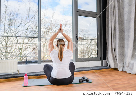 Curvy girl sit back in yoga pose Curvy girl sit back in yoga pose 76844155