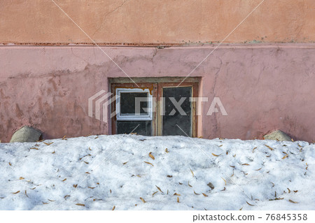 Old crooked wooden window of a rickety stone building Old crooked wooden window of a rickety stone building 76845358