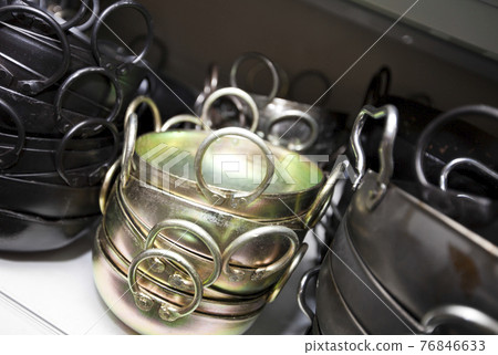 Stacked kitchen utensils in store Stacked kitchen utensils in store 76846633