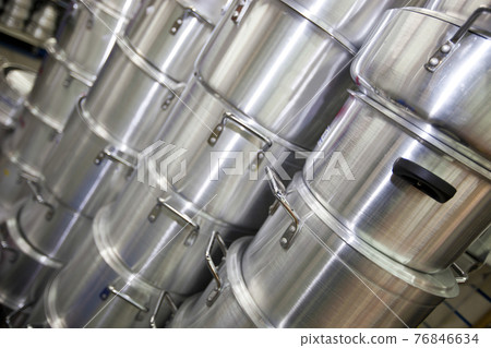 Stacked kitchen utensils in supermarket Stacked kitchen utensils in supermarket 76846634