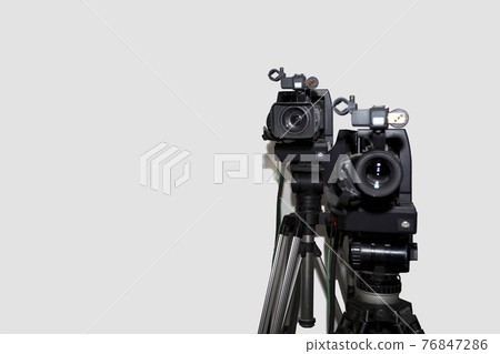 Camera and tripod against white background Camera and tripod against white background 76847286
