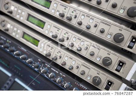 Close-up of audio recording equipment in control room 76847287