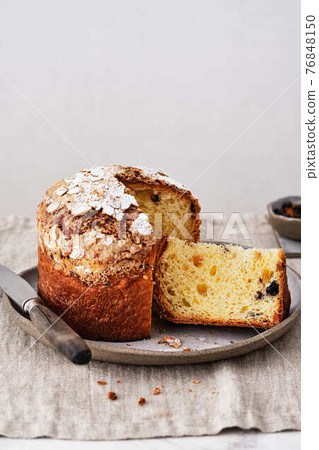 Panettone, italian christmas cake. Panettone with raisins and chocolate. Panettone, italian christmas cake. Panettone with raisins and chocolate. 76848150