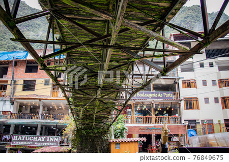 Machu Picchu village looking up from under the bridge 76849675