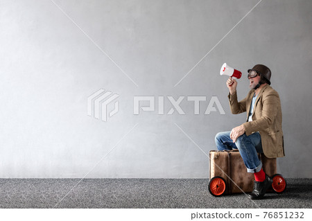 Senior businessman against concrete wall with copy space Senior businessman against concrete wall with copy space 76851232