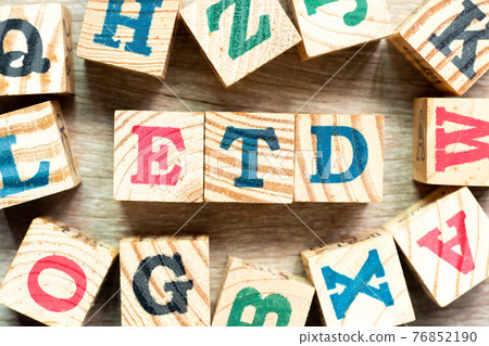 Alphabet letter block in word ETD (abbreviation of estimated time of departure or the estimated time of delivery) with another on wood background Alphabet letter block in word ETD (abbreviation of estimated time of departure or the estimated time of delivery) with another on wood background 76852190