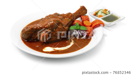 Braised Lamb Shank Masala Curry is a Yummy onion Tomato Cashewnut Gravy spice and yogurt 76852346
