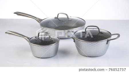 Set of empty stainless steel pots and pan isolated on white Set of empty stainless steel pots and pan isolated on white 76852737