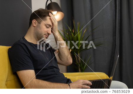 Depressed businessman calculating lockdown losses due to pandemic 76853029