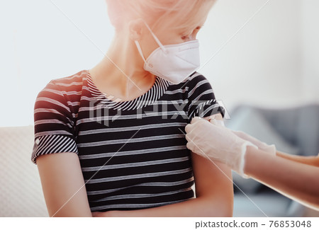 Woman and a doctor in the hospital after vaccination against Covid 19. 76853048