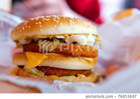 burger with chicken on the table of a fast food restaurant. close-up selective focus 76853697