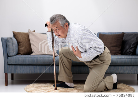 Senior man who collapses in the living room Senior man who collapses in the living room 76854095