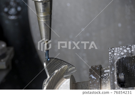 The 5-axis machining center cutting the boat propeller with solid ball end mill tool. The 5-axis machining center cutting the boat propeller with solid ball end mill tool. 76854231