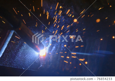 Close-up scene of the electric welding process. Close-up scene of the electric welding process. 76854233
